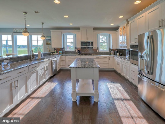 169 E Buckingham Dr, Rehoboth Beach, DE 19971 - kitchen featuring appliances with stainless steel finishes, a sink, recessed lighting, white cabinetry, and dark wood-style flooring