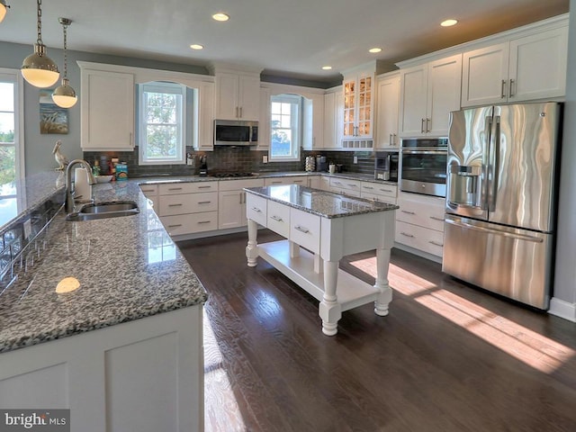 169 E Buckingham Dr, Rehoboth Beach, DE 19971 - kitchen with appliances with stainless steel finishes, a sink, plenty of natural light, backsplash, and recessed lighting