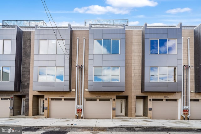 2340 Alter St, Philadelphia, PA 19146 - view of front of property with brick siding, driveway, and a garage
