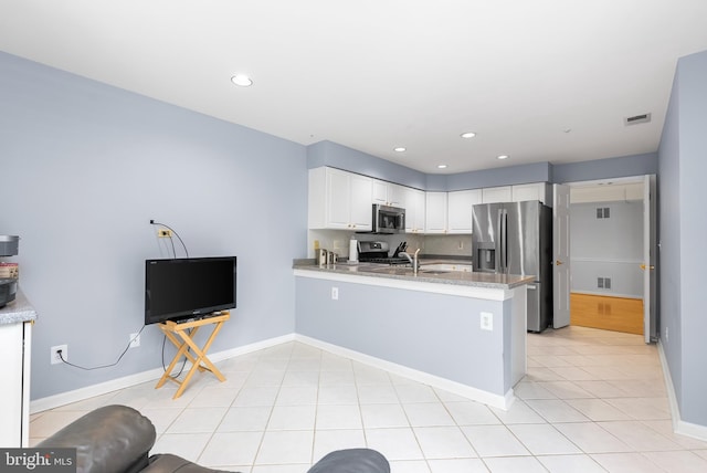 12310 Rosslare Ridge Rd Unit 301, Lutherville Timonium, MD 21093 - kitchen featuring stainless steel appliances, a peninsula, baseboards, white cabinets, and recessed lighting