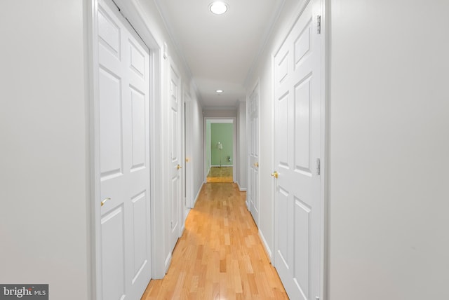 12310 Rosslare Ridge Rd Unit 301, Lutherville Timonium, MD 21093 - corridor featuring light wood-style flooring, ornamental molding, recessed lighting, and baseboards