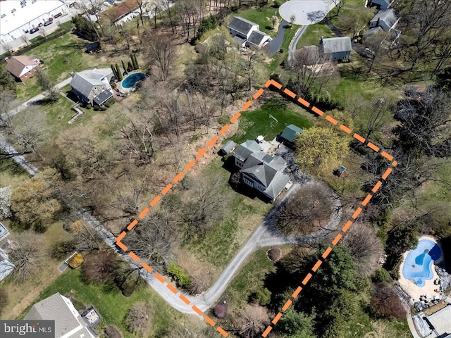 view of property location with a pool