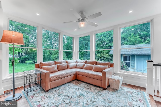 sunroom / solarium featuring plenty of natural light, wood finished floors, and recessed lighting