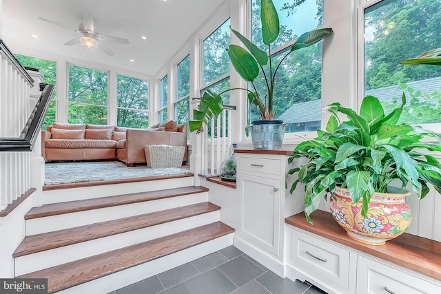sunroom / solarium featuring tile patterned floors and recessed lighting