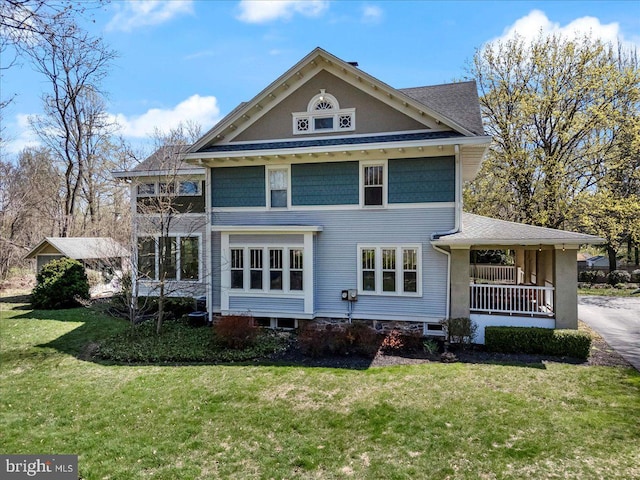 rear view of house with a lawn