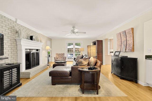 5117 Pheasant Ridge Rd, Fairfax, VA 22030 - living area featuring a ceiling fan, light wood finished floors, ornamental molding, brick wall, and a brick fireplace