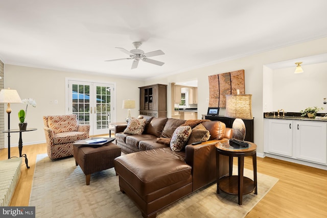 5117 Pheasant Ridge Rd, Fairfax, VA 22030 - living room with light wood-style flooring, ceiling fan, crown molding, and french doors