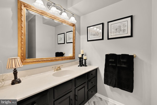 5117 Pheasant Ridge Rd, Fairfax, VA 22030 - bathroom featuring vanity, marble look tiles, and baseboards