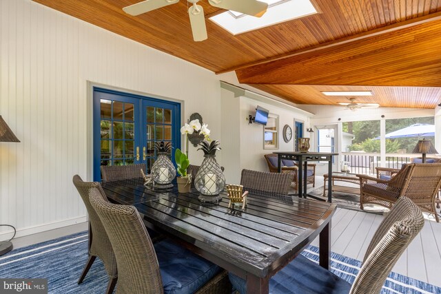 5117 Pheasant Ridge Rd, Fairfax, VA 22030 - sunroom with a skylight, beam ceiling, and french doors