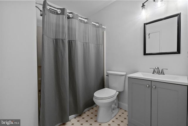 full bathroom featuring vanity, toilet, curtained shower, tile patterned floors, and baseboards