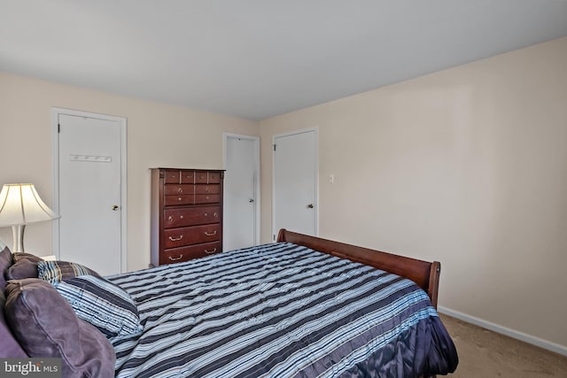 bedroom featuring carpet floors and baseboards