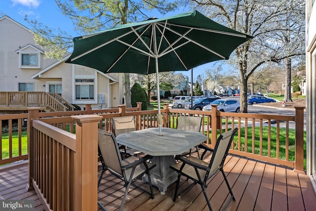 wooden deck with outdoor dining space