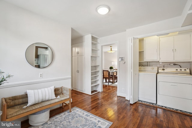 206 E Indian Spring Dr, Silver Spring, MD 20901 - washroom featuring cabinet space, washing machine and clothes dryer, and dark wood finished floors
