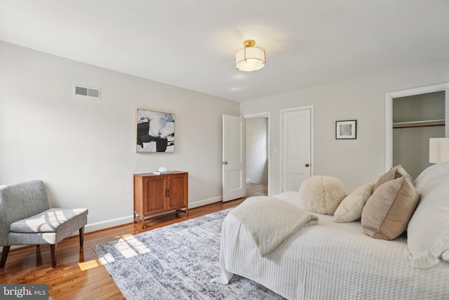 206 E Indian Spring Dr, Silver Spring, MD 20901 - bedroom with baseboards, light wood finished floors, and a closet