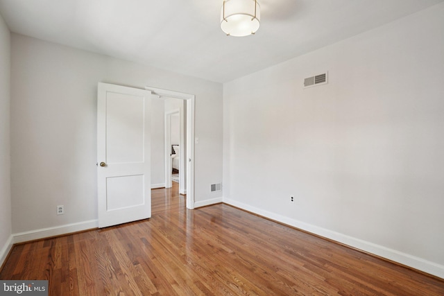 206 E Indian Spring Dr, Silver Spring, MD 20901 - empty room featuring wood finished floors and baseboards