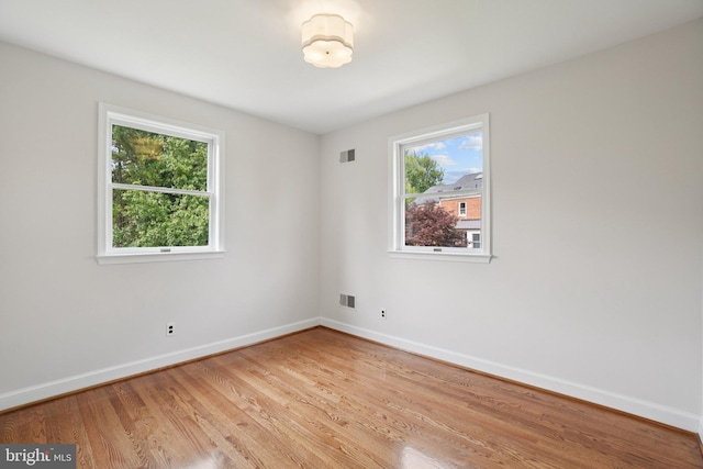 206 E Indian Spring Dr, Silver Spring, MD 20901 - spare room with healthy amount of natural light, baseboards, and light wood-style flooring