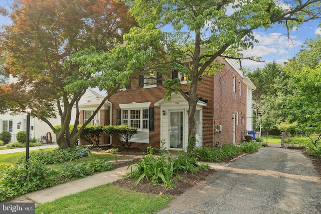 206 E Indian Spring Dr, Silver Spring, MD 20901 - view of front of house featuring brick siding, a gate, and asphalt driveway