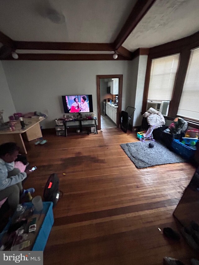 6146 W Columbia Ave, Philadelphia, PA 19151 - living room with cooling unit, wood finished floors, and lofted ceiling with beams