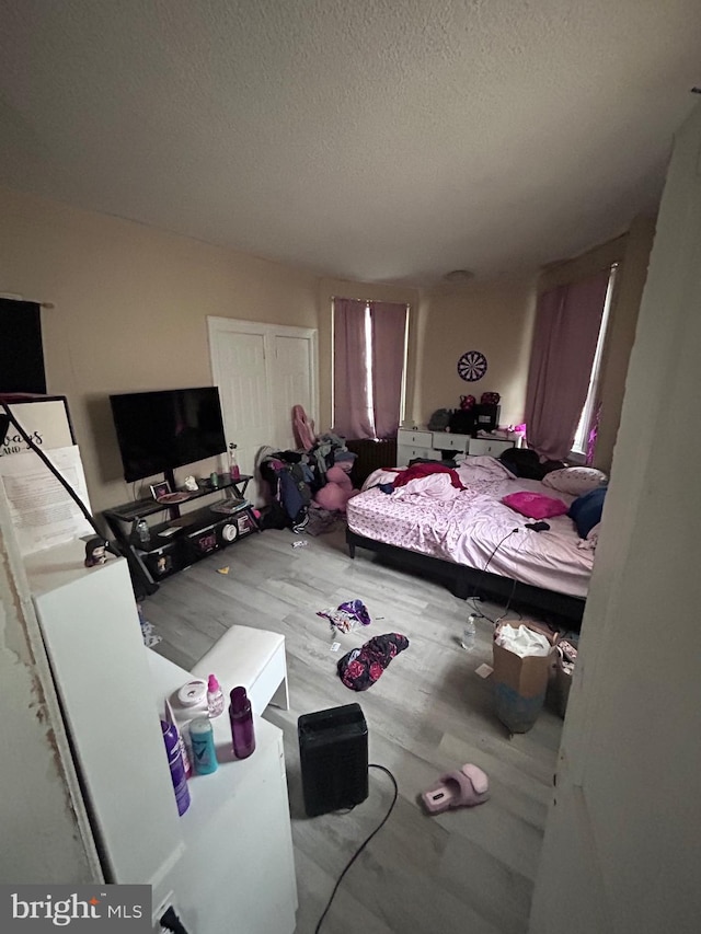 6146 W Columbia Ave, Philadelphia, PA 19151 - bedroom with a textured ceiling, wood finished floors, and a closet