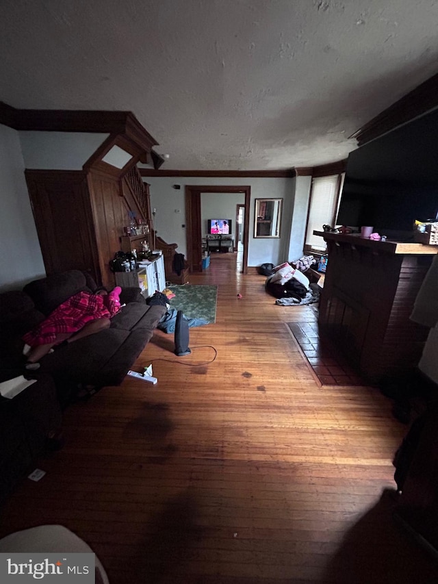 6146 W Columbia Ave, Philadelphia, PA 19151 - living area featuring a textured ceiling and wood finished floors