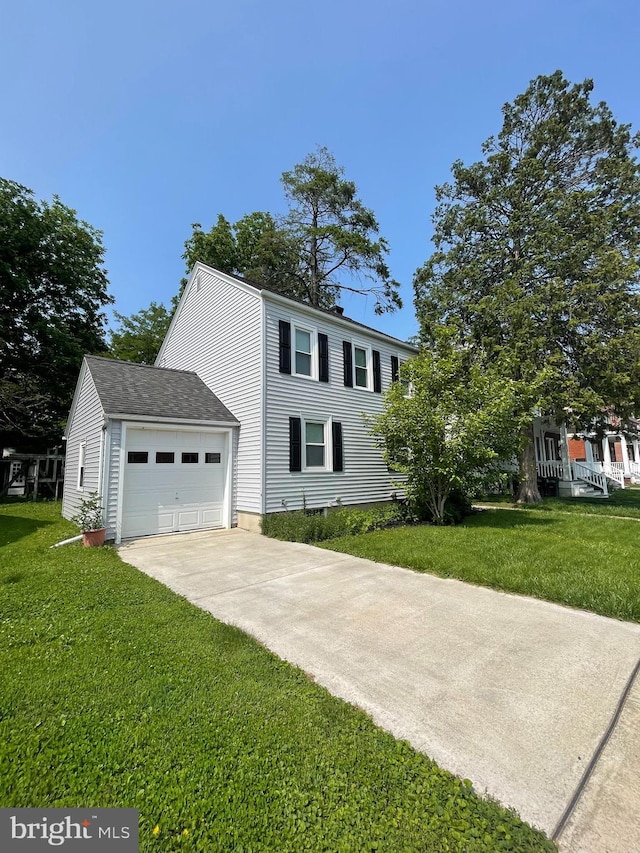 1221 Elm Ave, Lancaster, PA 17603 - view of front of home featuring driveway, a front yard, and an attached garage