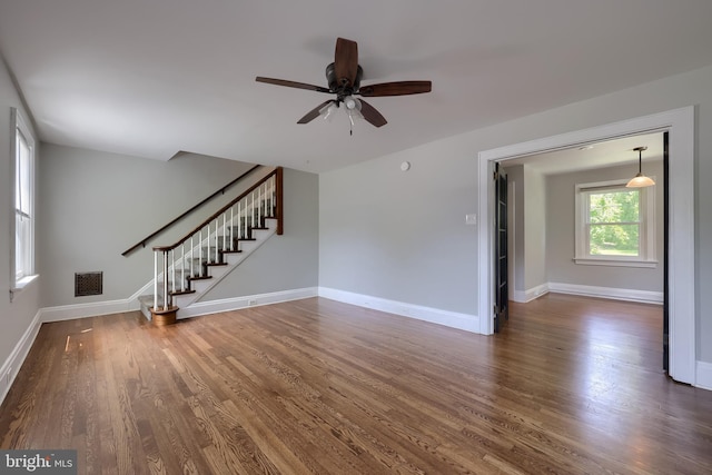 1221 Elm Ave, Lancaster, PA 17603 - unfurnished living room featuring stairway, a ceiling fan, wood finished floors, and baseboards