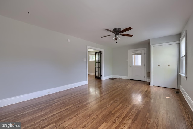 1221 Elm Ave, Lancaster, PA 17603 - unfurnished living room featuring ceiling fan, wood finished floors, and baseboards