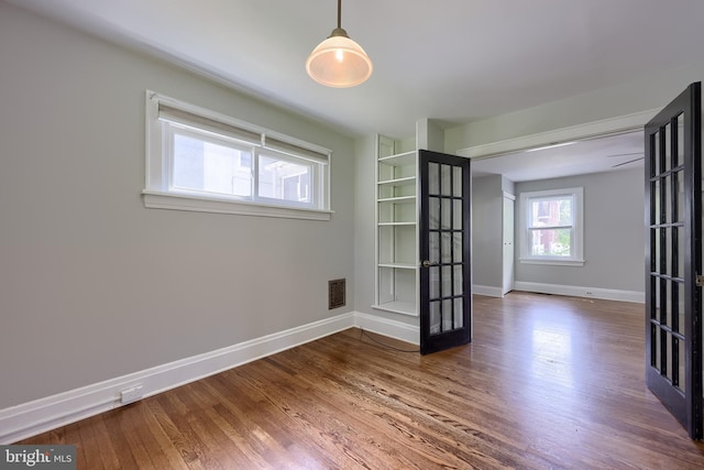 1221 Elm Ave, Lancaster, PA 17603 - empty room with wood finished floors, baseboards, and french doors