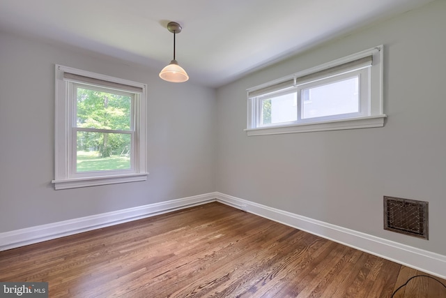 1221 Elm Ave, Lancaster, PA 17603 - empty room featuring healthy amount of natural light, baseboards, and wood finished floors