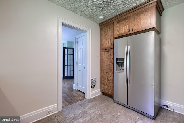 1221 Elm Ave, Lancaster, PA 17603 - kitchen with stainless steel fridge with ice dispenser, baseboards, and an ornate ceiling