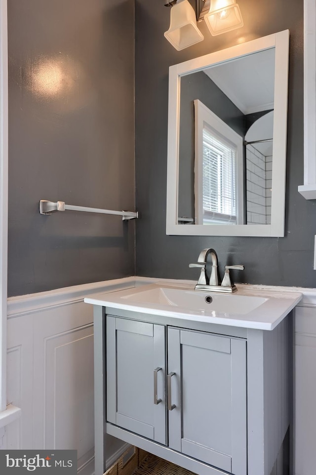 1221 Elm Ave, Lancaster, PA 17603 - bathroom with a decorative wall, vanity, and a wainscoted wall