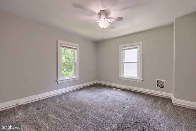 1221 Elm Ave, Lancaster, PA 17603 - empty room featuring a ceiling fan, dark carpet, and baseboards