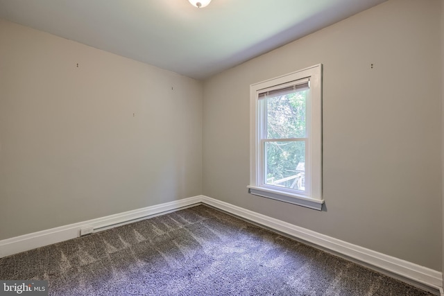 1221 Elm Ave, Lancaster, PA 17603 - spare room with dark colored carpet and baseboards
