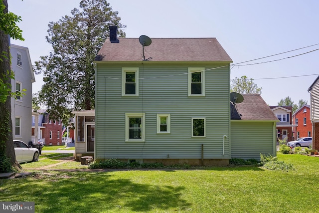 1221 Elm Ave, Lancaster, PA 17603 - rear view of property featuring a chimney and a lawn