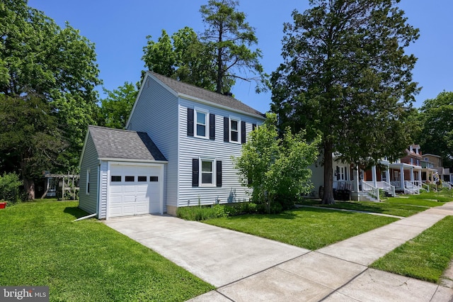 1221 Elm Ave, Lancaster, PA 17603 - colonial inspired home featuring roof with shingles, an attached garage, a front yard, and driveway