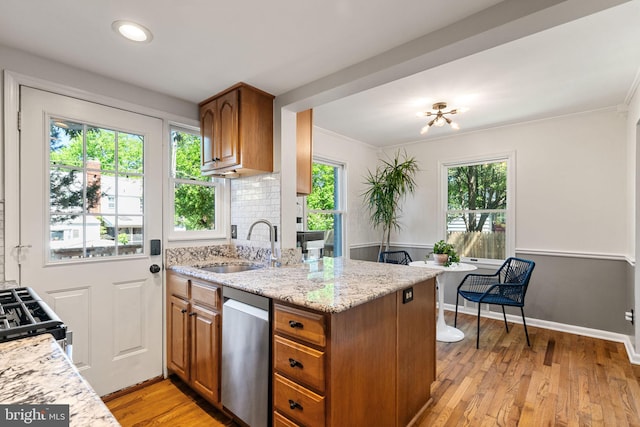 6002 Williamsburg Rd, Alexandria, VA 22303 - kitchen featuring stainless steel dishwasher, brown cabinetry, light stone countertops, light wood-style floors, and ornamental molding