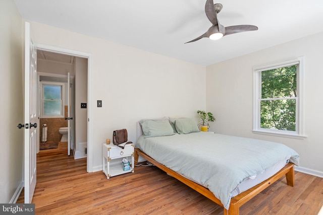 6002 Williamsburg Rd, Alexandria, VA 22303 - bedroom featuring attic access, light wood-style floors, baseboards, and ceiling fan