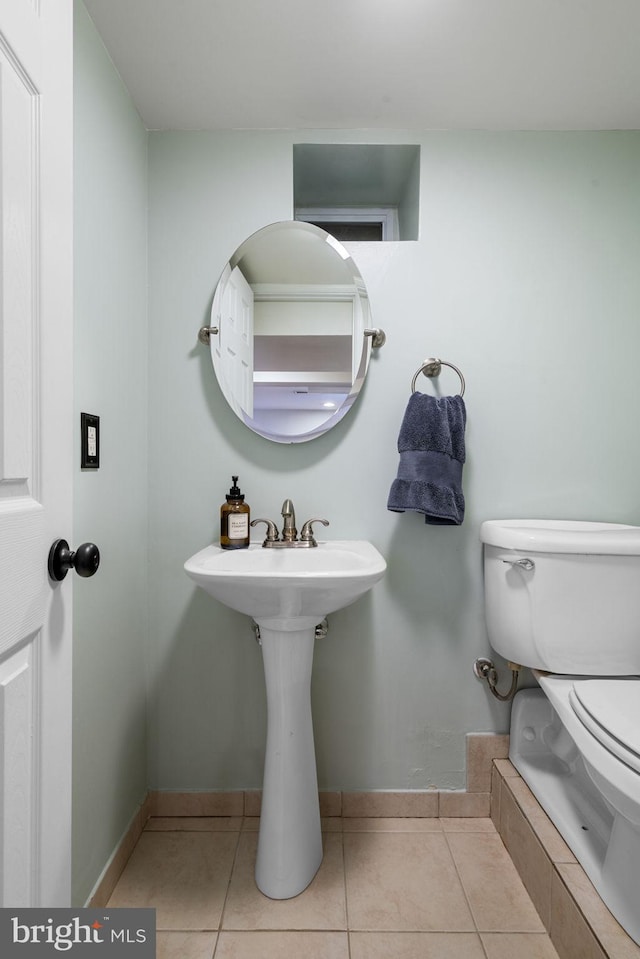 6002 Williamsburg Rd, Alexandria, VA 22303 - half bath featuring toilet, tile patterned floors, and baseboards