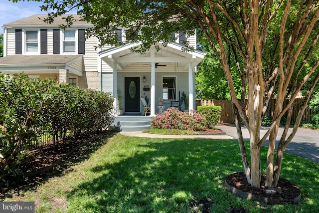 6002 Williamsburg Rd, Alexandria, VA 22303 - view of front of home featuring a ceiling fan, brick siding, covered porch, and roof with shingles
