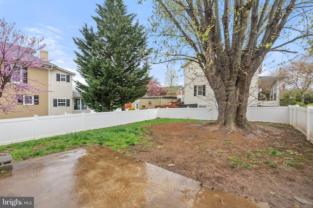 view of yard featuring a patio and a fenced backyard