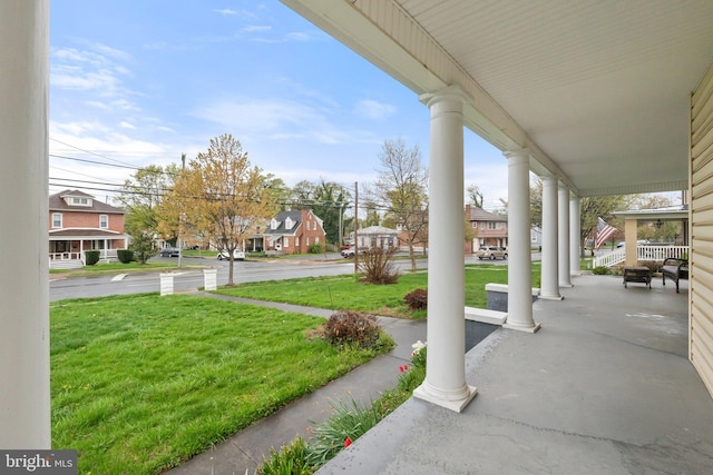 view of patio featuring a residential view and a porch