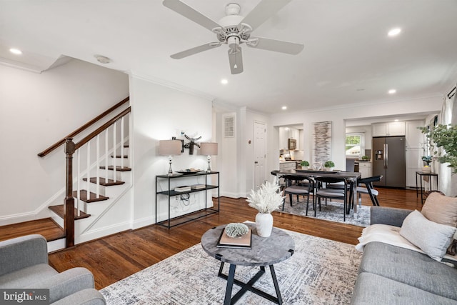 6005 Monticello Rd, Alexandria, VA 22303 - living area featuring wood finished floors, stairway, a ceiling fan, recessed lighting, and crown molding