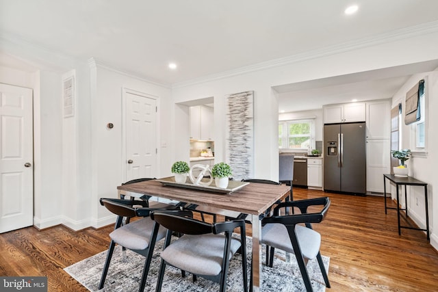 6005 Monticello Rd, Alexandria, VA 22303 - dining space featuring wood finished floors, recessed lighting, baseboards, and crown molding
