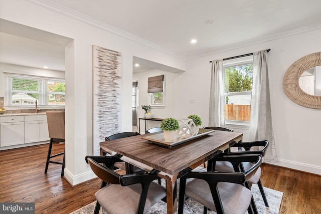 6005 Monticello Rd, Alexandria, VA 22303 - dining space featuring crown molding, baseboards, dark wood-type flooring, and recessed lighting