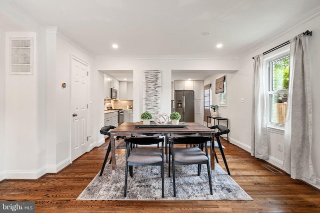 6005 Monticello Rd, Alexandria, VA 22303 - dining area with dark wood finished floors, baseboards, ornamental molding, and recessed lighting