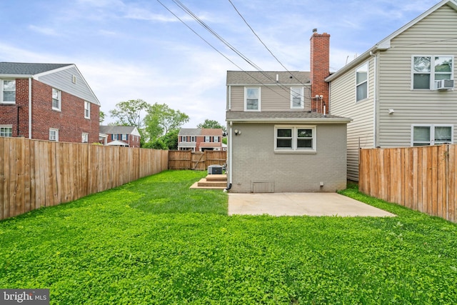 6005 Monticello Rd, Alexandria, VA 22303 - back of property featuring brick siding, a chimney, a patio, and cooling unit