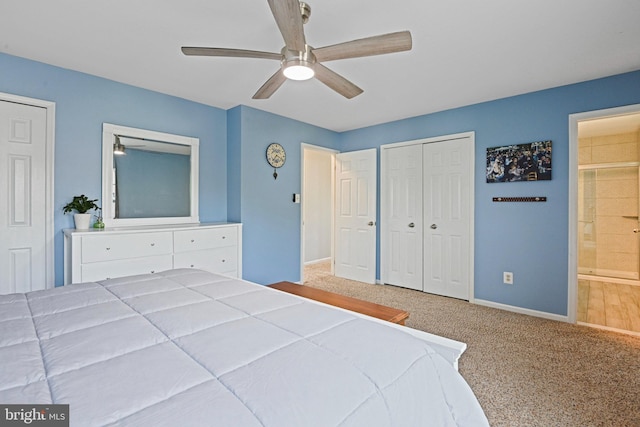 bedroom with ceiling fan, baseboards, a closet, ensuite bathroom, and carpet flooring