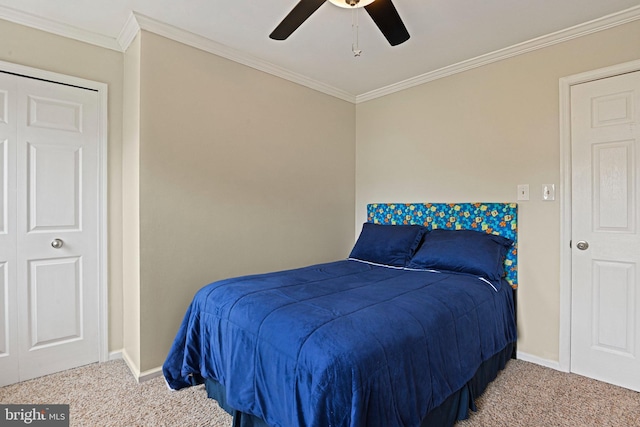 carpeted bedroom featuring crown molding, a ceiling fan, and baseboards