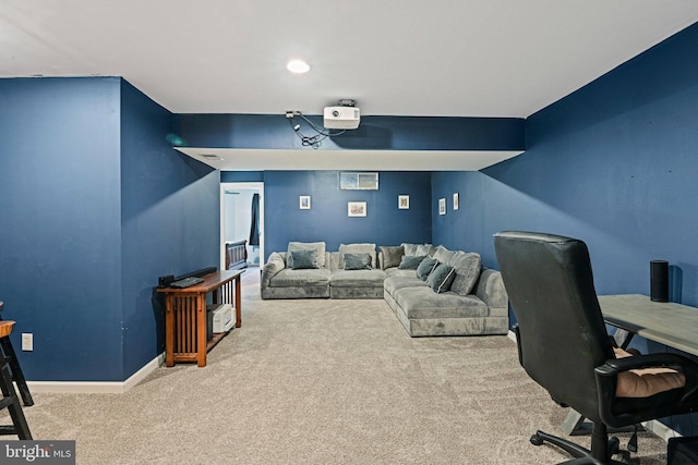 home theater featuring baseboards and carpet flooring