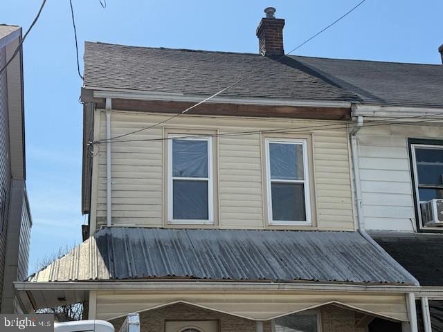 1132 Church St, Lebanon, PA 17046 - view of property exterior with roof with shingles, metal roof, and a chimney